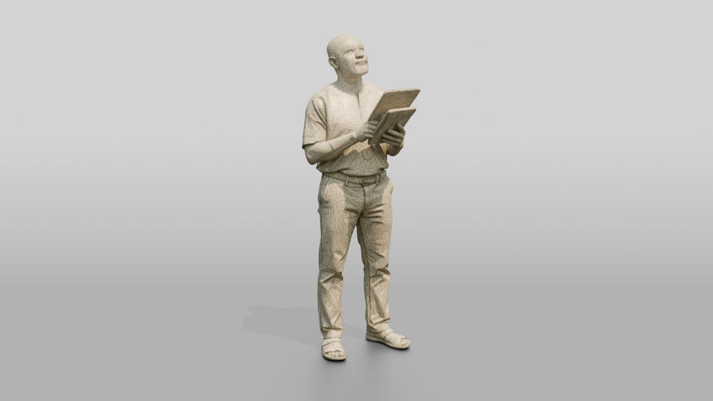Elderly African Man Holding a Tablet Looking Up
