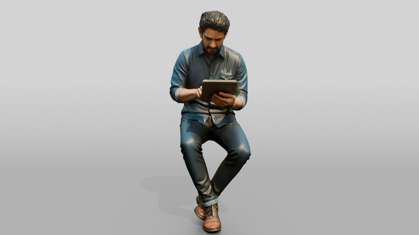 Man Using a Tablet on a Stool