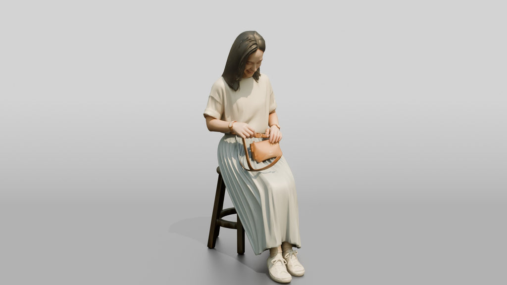 Woman Sitting with Designer Pouch