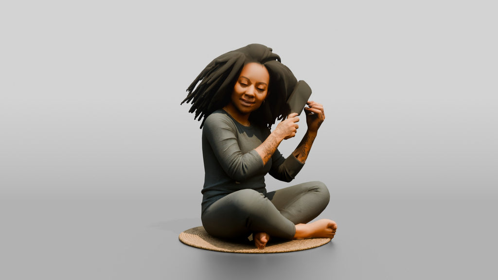 Homeless Woman Sitting Cross-legged While Brushing Out Her Hair