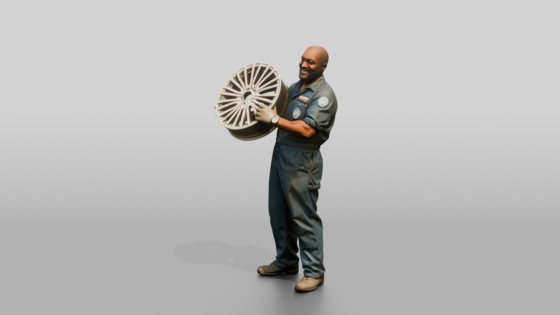 Mechanic Lifting an Alloy Wheel