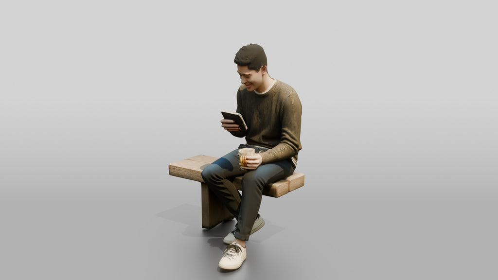 Young Chinese Man Relaxing on a Bench with Phone
