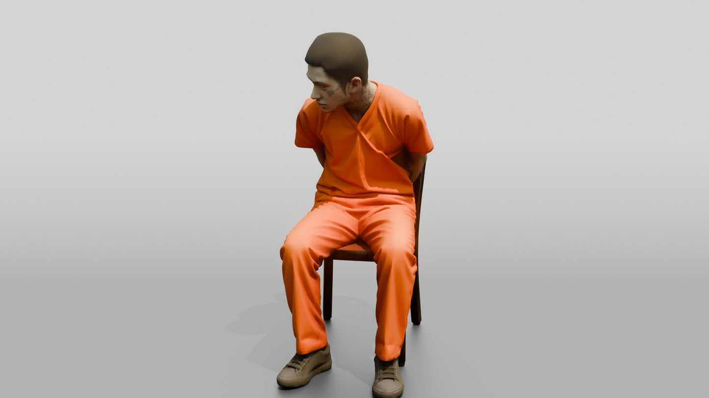 East Asian Male Prisoner Sitting Slouched in a Metal Chair