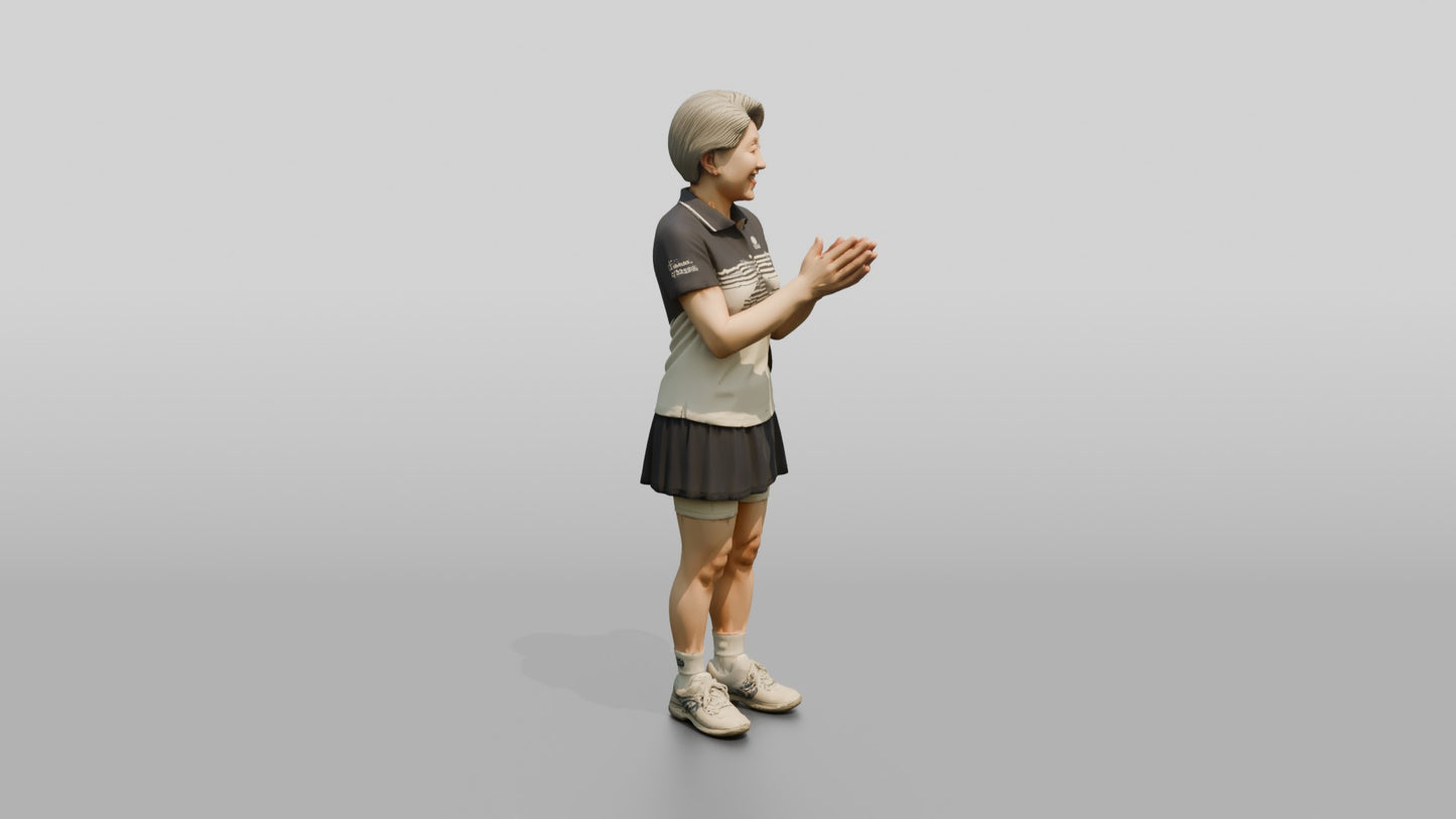 Senior Female Tennis Player Applauding a Point