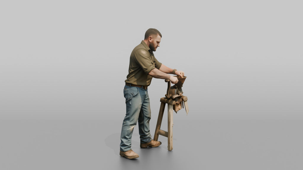Farmer Operating Hand Cranked Corn Sheller