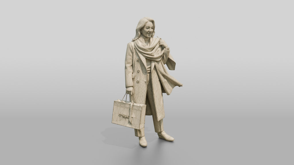 Woman Adjusting Scarf with Designer Shopping Bag