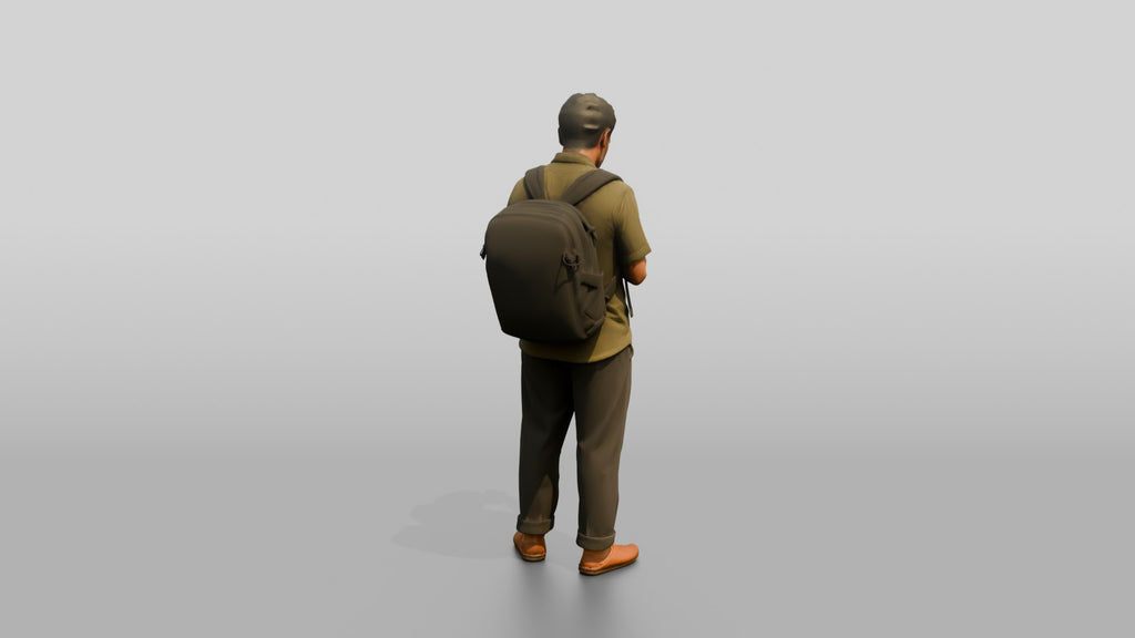 African Man with a Backpack Checking His Phone
