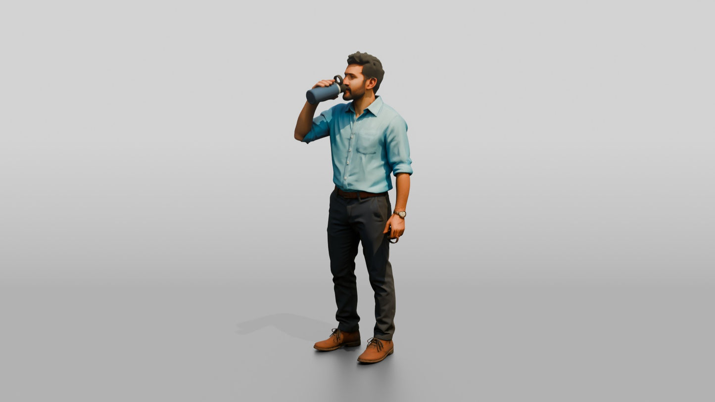 Man Sipping Coffee in a Blue Shirt