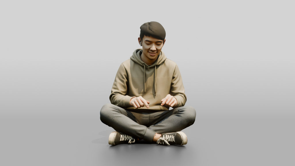 Young Chinese Man Sitting Cross-Legged Relaxing