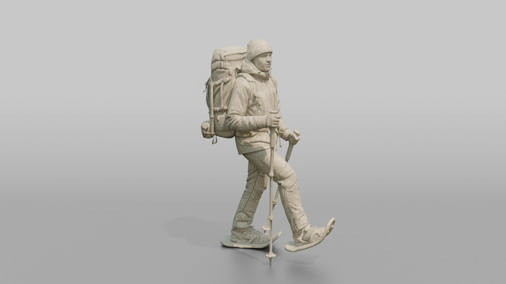 Winter Hiker Stepping Through Deep Snow