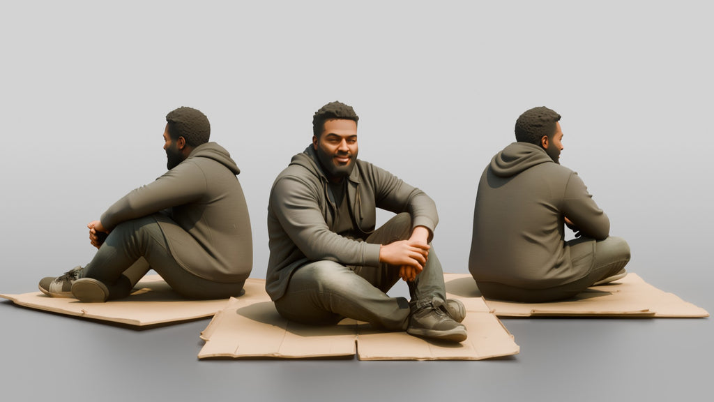 Homeless Man Sitting Flat on a Piece of Cardboard