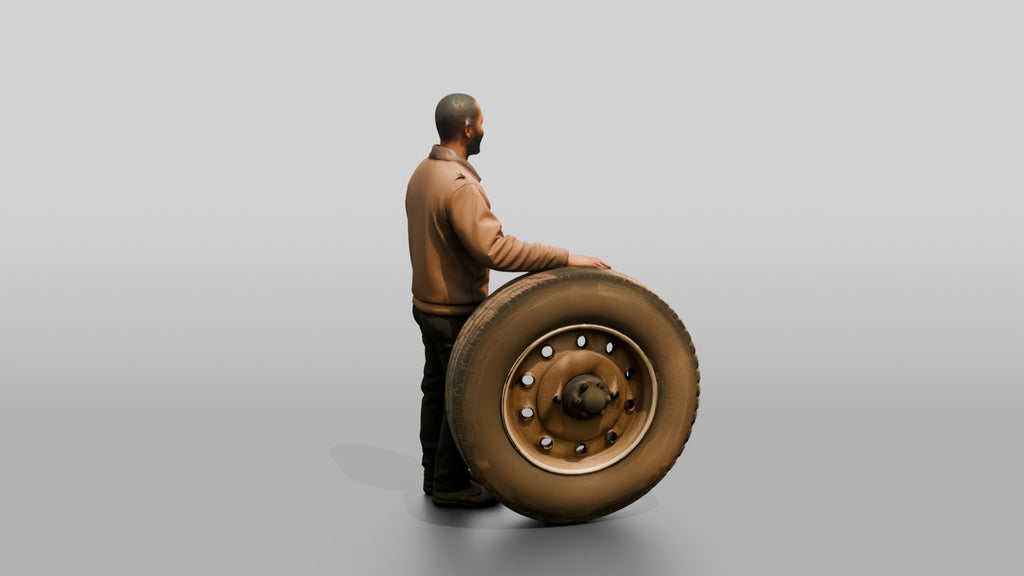 Mechanic Resting Hand on a Truck Tire