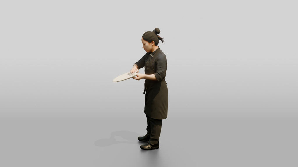 Chef Wiping a Plate Rim
