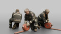 Firefighter Woman Rolling Up a Flat Fire Hose on the Ground