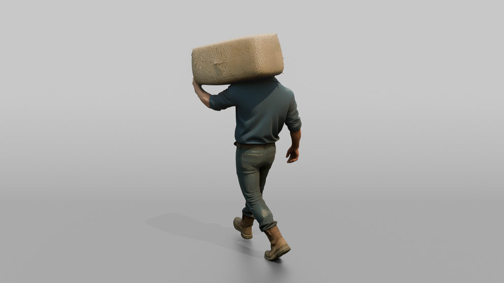 Farmer Carrying Large Bale Of Hay Over