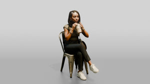 Young Black Woman Seated Drinking Coffee with Handbag - 3D character model, view 1