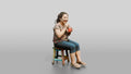 Chinese Woman Sitting on a Stool Drinking