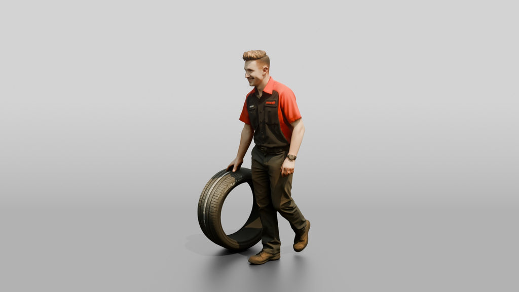 Mechanic Rolling a Performance Tire