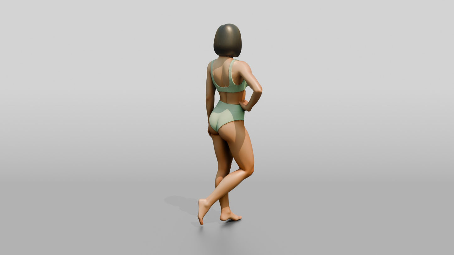 Woman in Mint Two-Piece Swimsuit with Hand on Hip