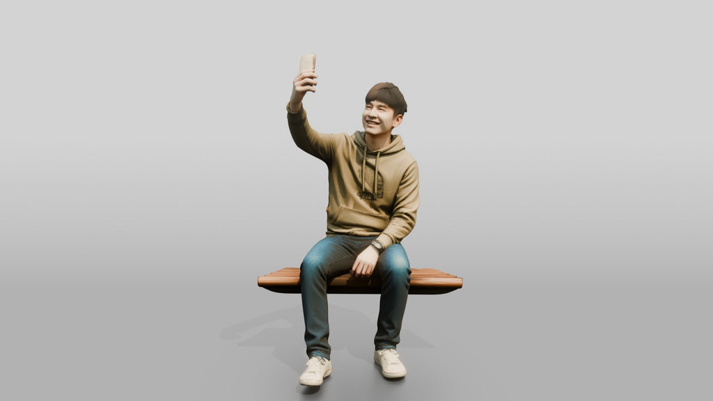 Young Chinese Man Taking a Selfie on a Bench