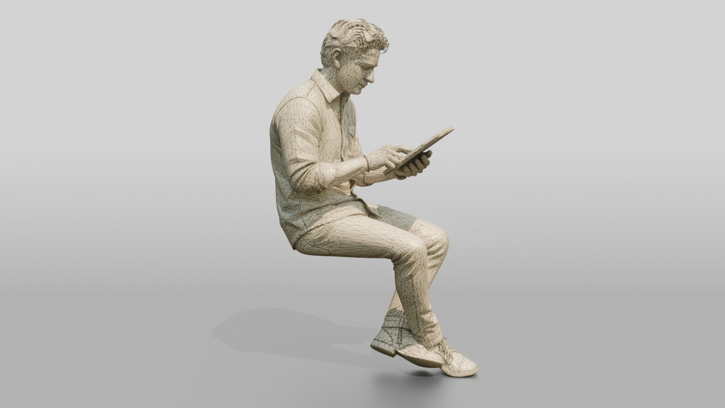 Man Using a Tablet on a Stool