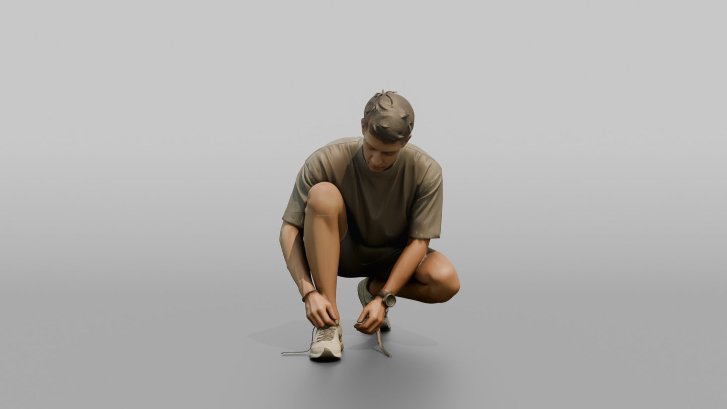 Man Crouching to Retie His Sneakers