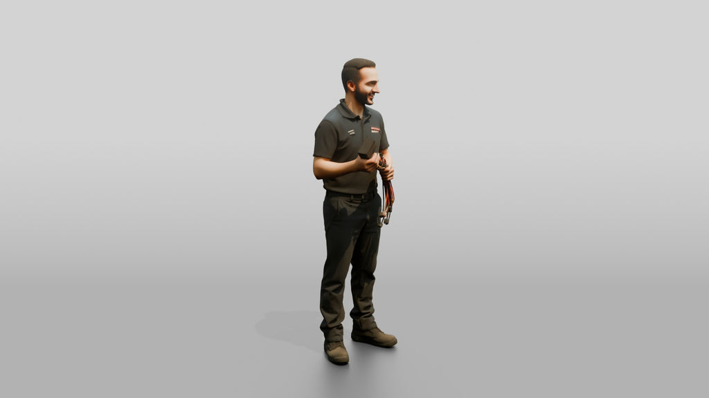 Mechanic Holding a Wire Harness Connector