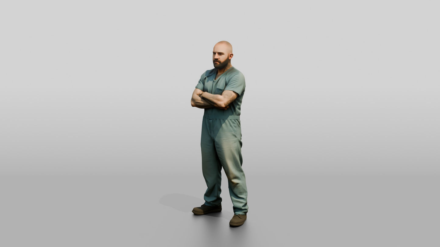 White Male Prisoner Standing with His Arms Crossed Defensively