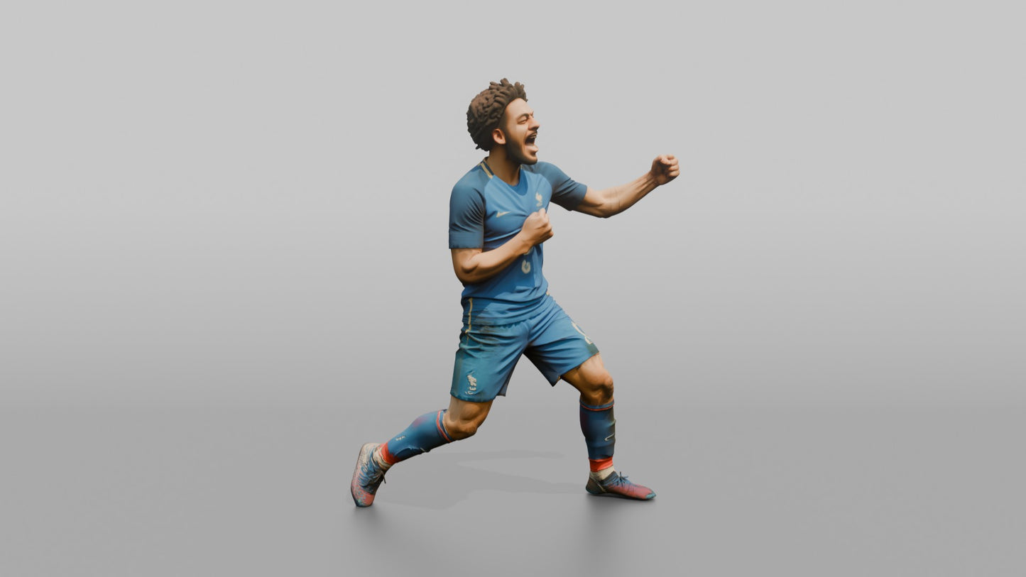 French Player Grabbing His Jersey Crest in Triumph