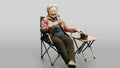 Elderly Chinese Woman Relaxing with Tea Outdoors
