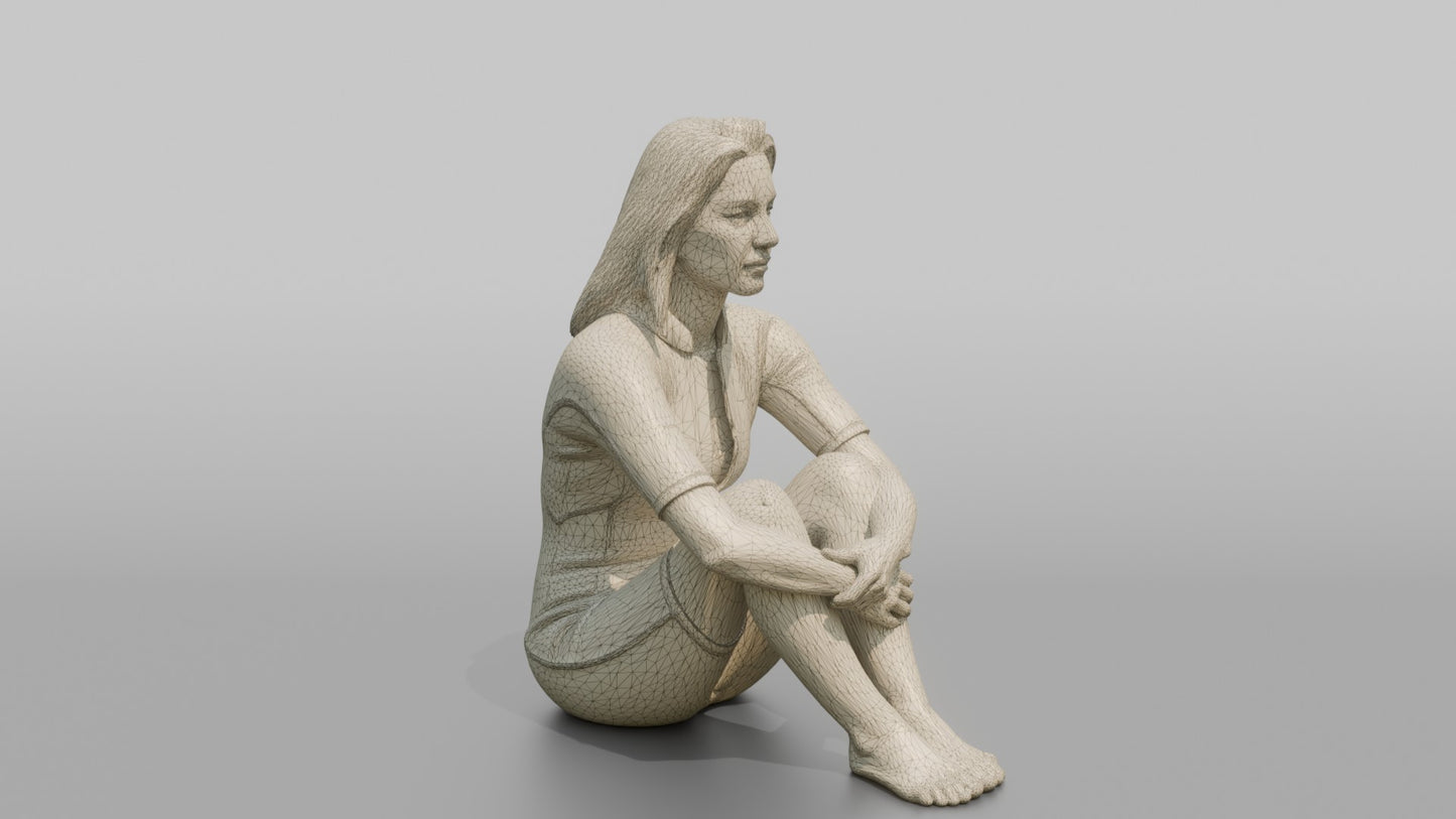 Surfer Sitting and Hugging Her Knees
