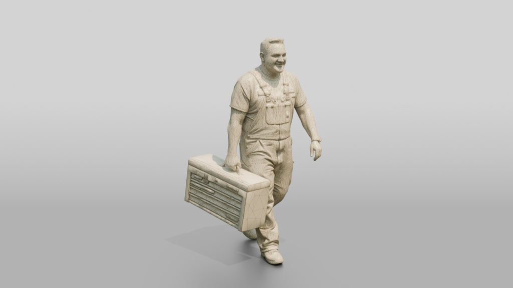 Mechanic Carrying a Toolbox