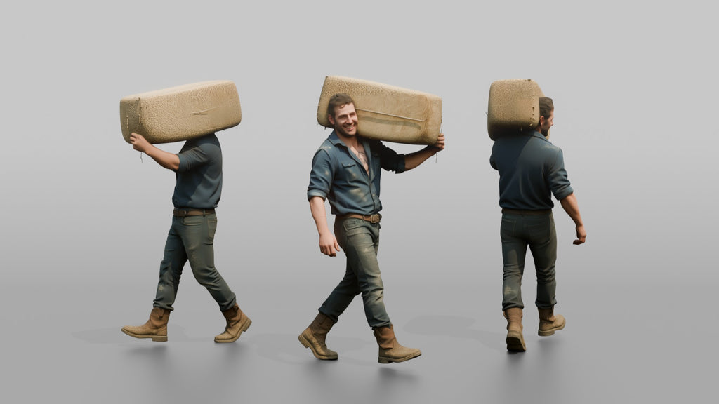 Farmer Carrying Large Bale Of Hay Over