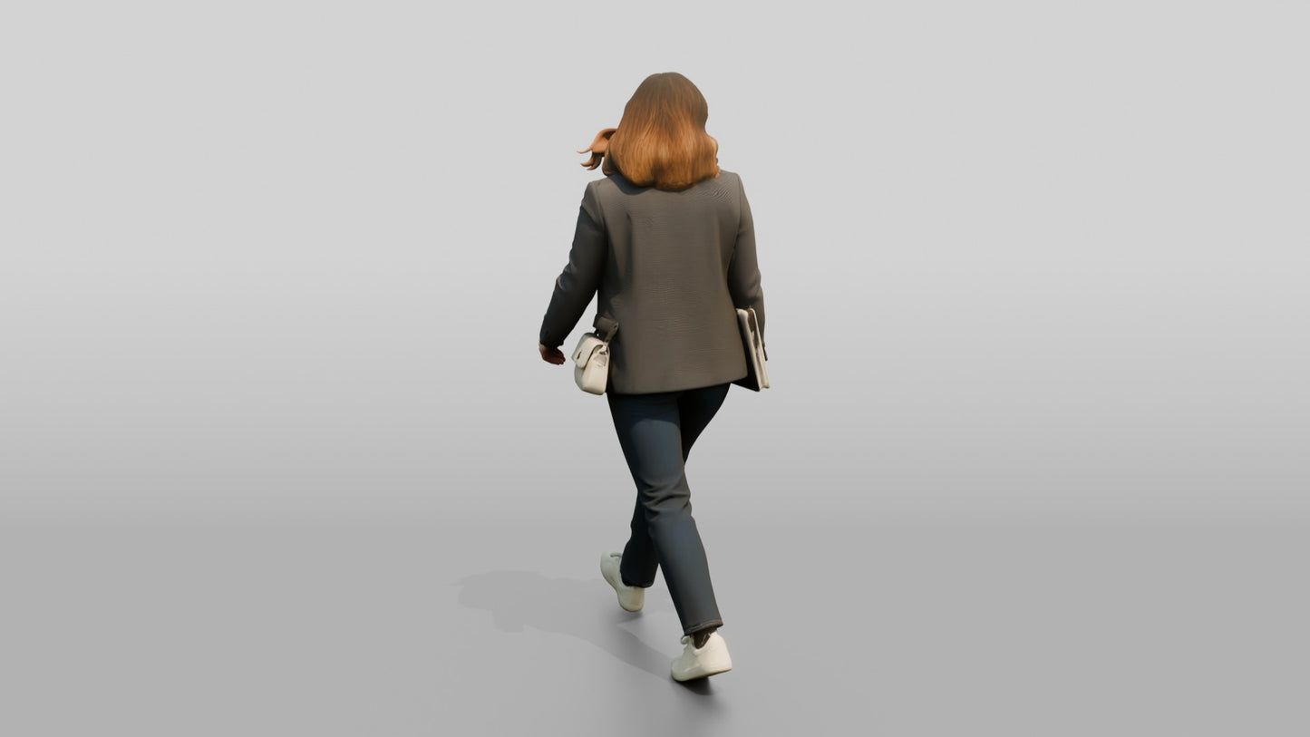 Businesswoman Walking with a Laptop
