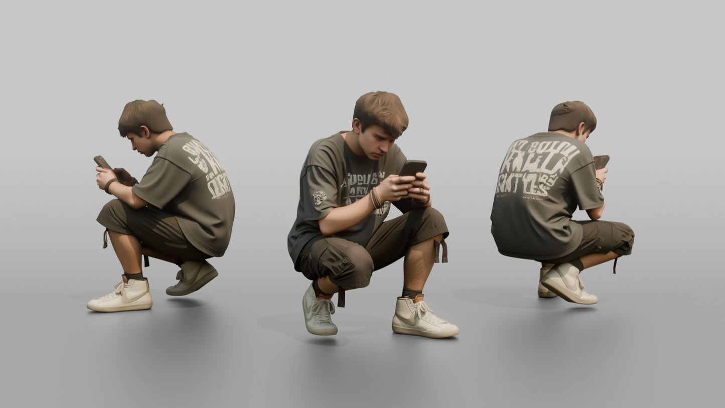 Teenage Boy Crouching to Look at His Phone