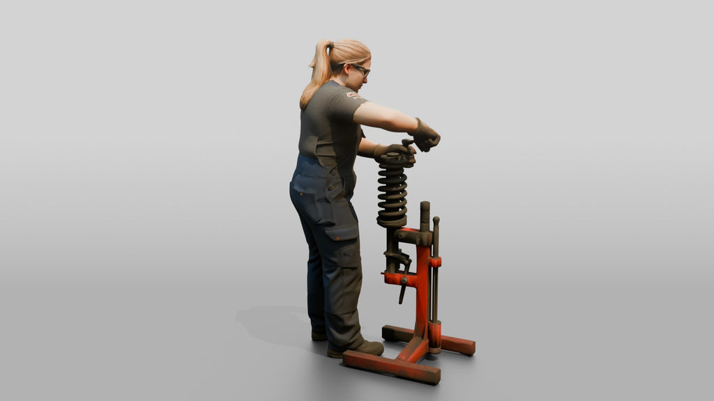 Mechanic Replacing a Shock Absorber