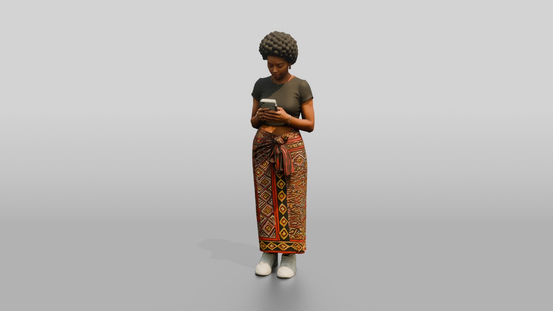 African Woman in a Wrap Skirt Looking at Her Phone