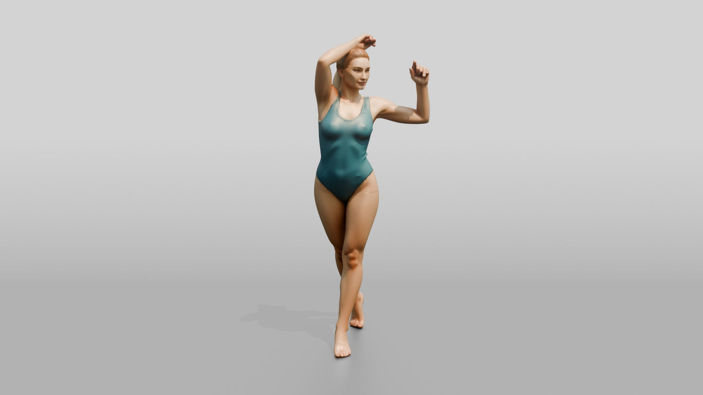 Woman in Teal Swimsuit in a Dancing Pose