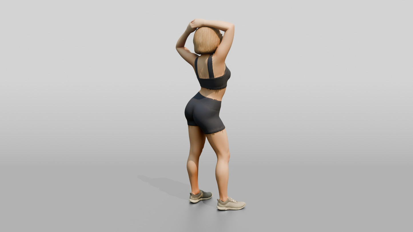 Blonde Woman in Charcoal Activewear Adjusting Her Hair