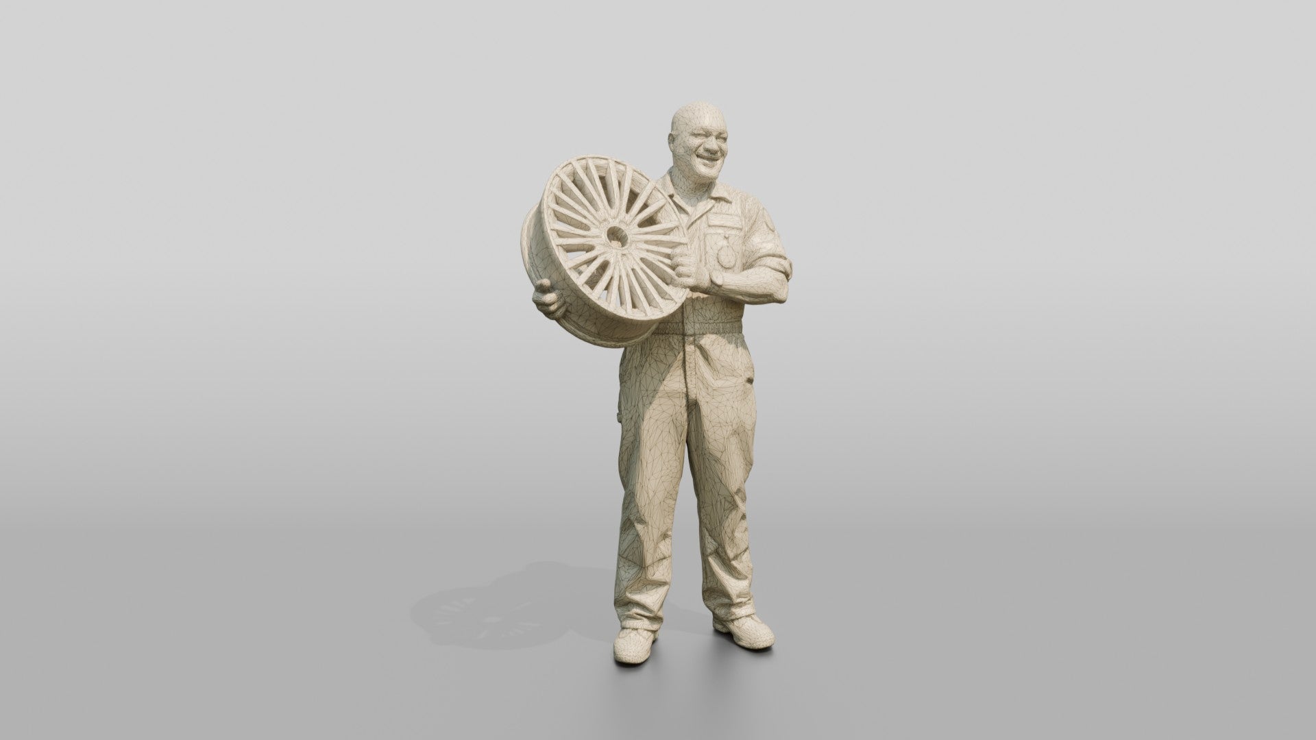 Mechanic Lifting an Alloy Wheel