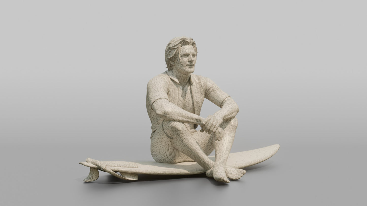 Surfer Sitting on His Surfboard