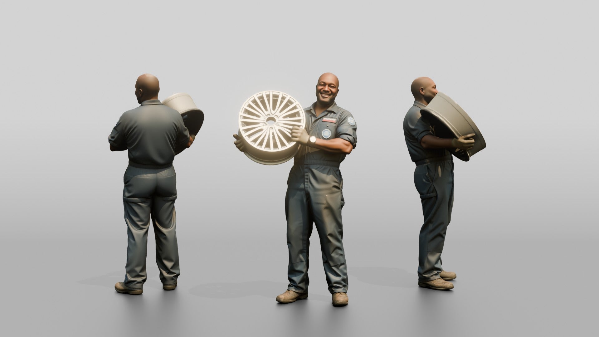 Mechanic Lifting an Alloy Wheel