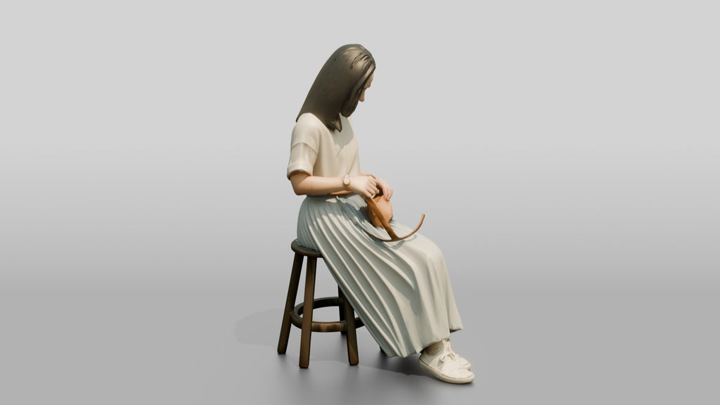 Woman Sitting with Designer Pouch