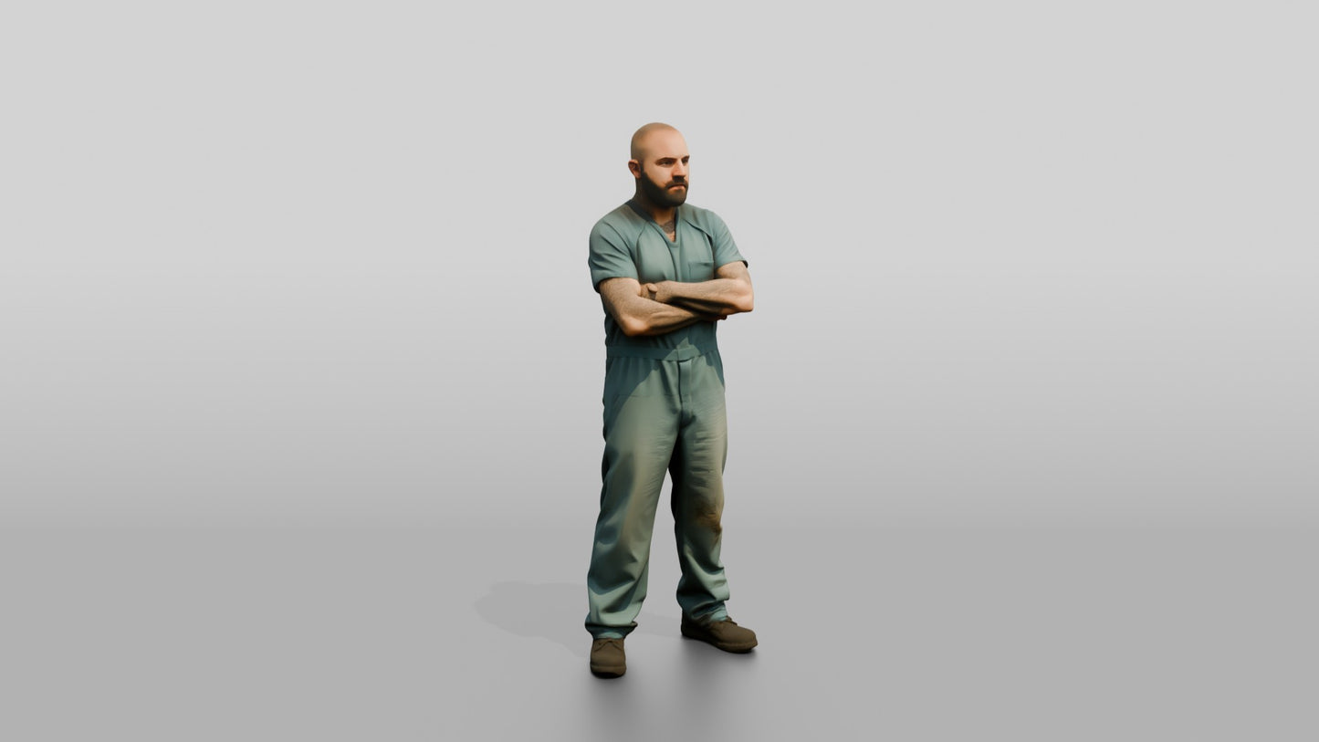 White Male Prisoner Standing with His Arms Crossed Defensively