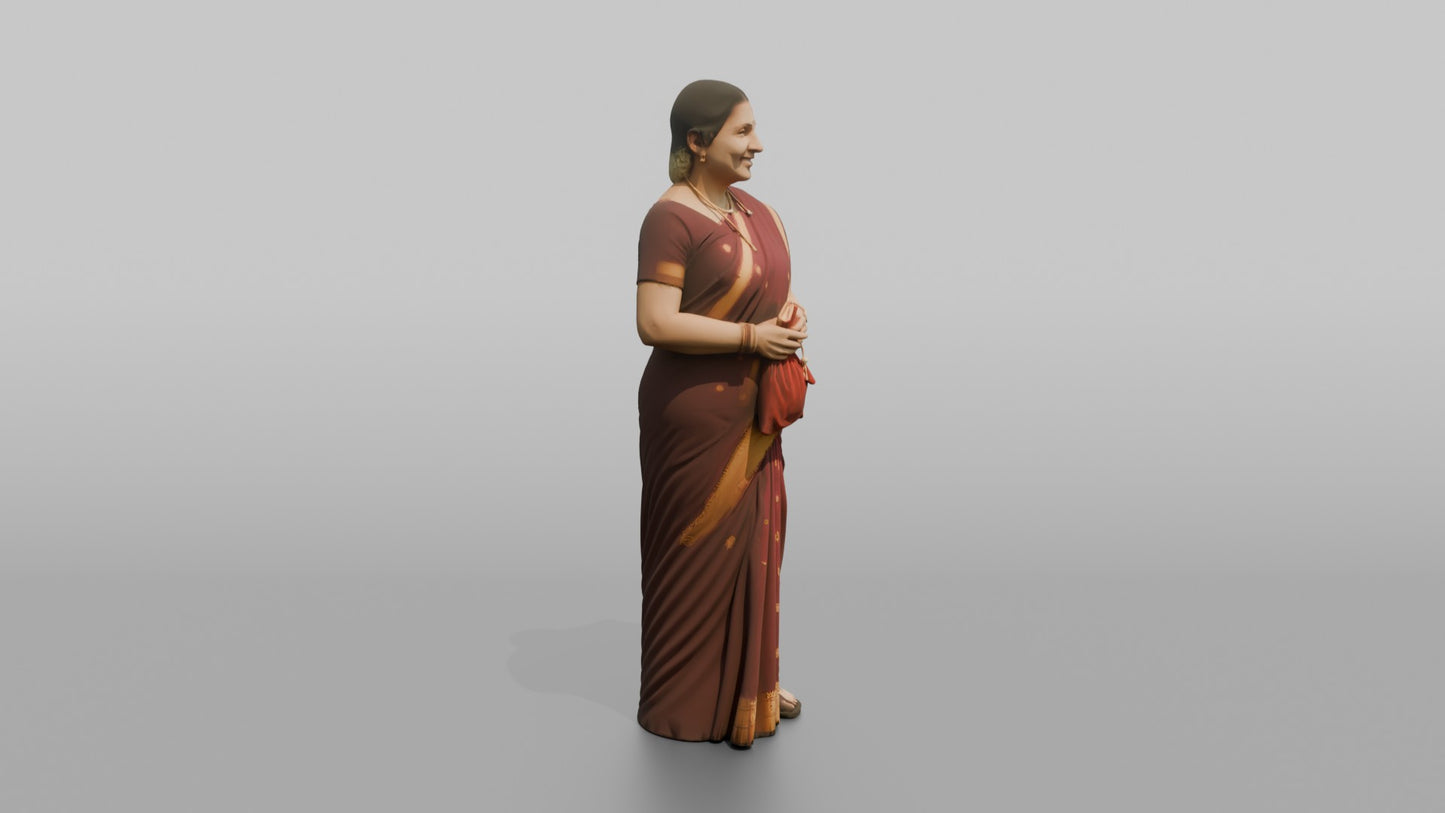 South Asian Wedding Guest Holding a Velvet Gift Pouch