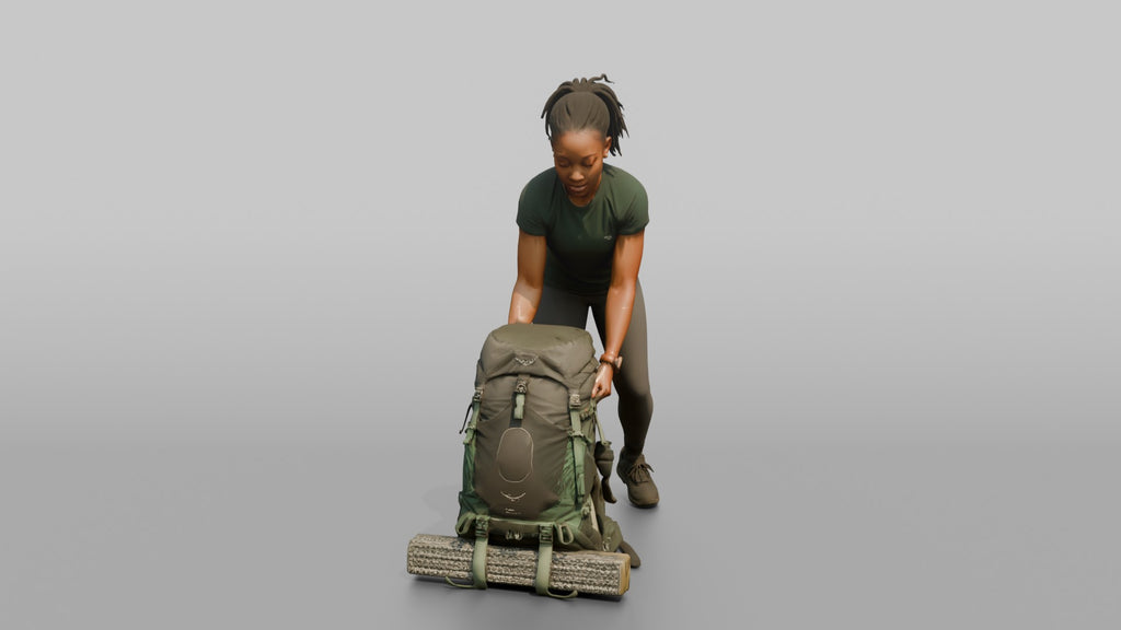 Backpacker Lowering Her Pack to the Ground
