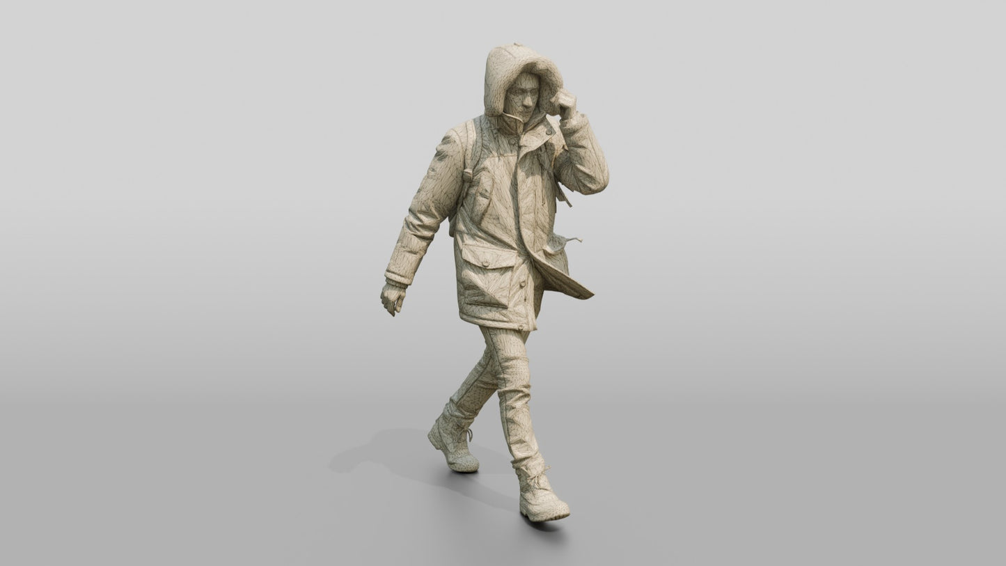 Middle Eastern Man in Grey Parka Walking Against Wind