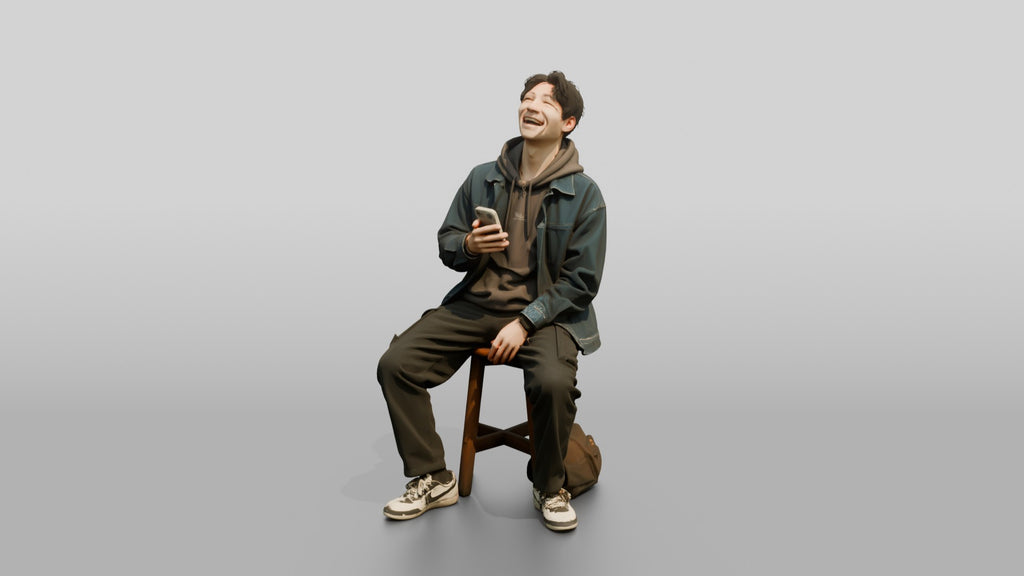 Asian Man Laughing at Phone