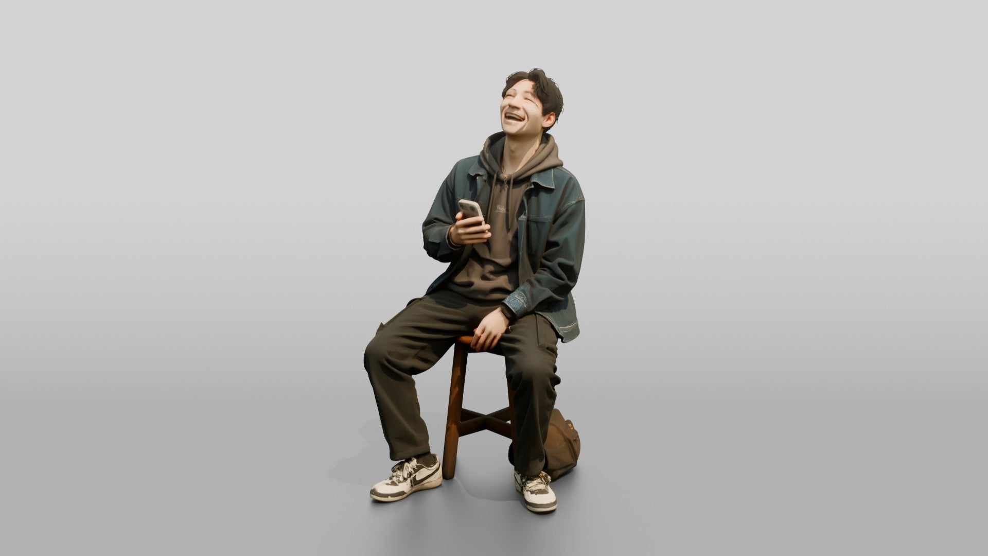 Asian Man Laughing at Phone
