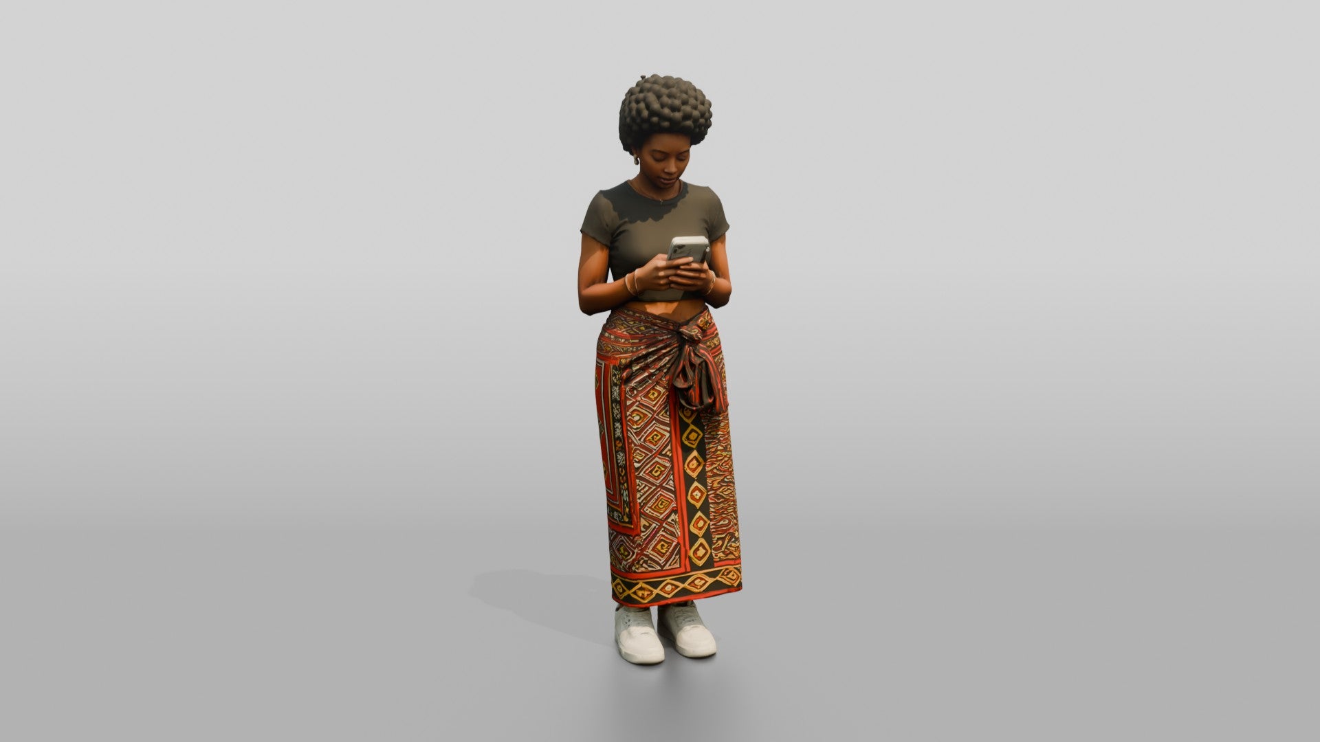 African Woman in a Wrap Skirt Looking at Her Phone